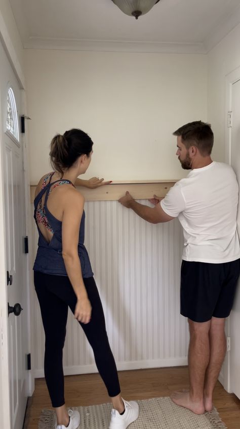 Narrow Entryway Mudroom, Beadboard Wallpaper Entryway, Small Entryway Behind Door, Small Entryway Paneling, Entry Hooks Decor, Indoor Front Door Decor, Diy Small Entryway Ideas, Pole Wrap Entryway, Wainscoting Entryway Hooks