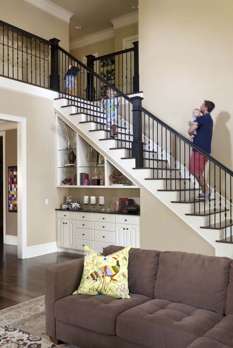 love this open floorplan, efficient use of space (under stairwell storage) and pretty coloring Bar Under Stairs, Under Staircase, Under Stairs Storage Solutions, Space Under Stairs, تحت الدرج, Stair Shelves, Casa Hobbit, Home Engineering, Staircase Storage