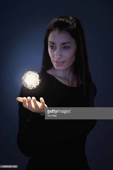 Stock Photo : Young woman holding hand beneath glowing ball of fibre optic wires Hand Holding Something, Hand Reference, Human Reference, Body Reference Poses, Halloween This Year, Human Poses Reference, Figure Poses, Poses References, Human Poses