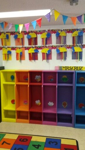 Colorful cubbies. Each child has their own and their projects are clipped on the the coordinating color above them. Classroom Cubbies, Decor Classroom, Coordinating Colors, Early Years, Cubbies, Classroom Ideas, Bookcase, Preschool, Shelves