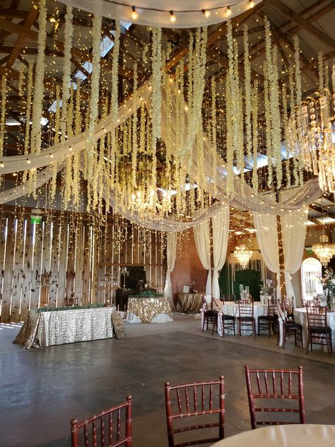 Light Garland Wedding, Ceiling Drapery With Fairy Lights, Flowers Falling From Ceiling, Hanging Fairy Lights Wedding, Fairy Lights Wedding Ceiling Lights, Fairy Lights From Ceiling, Fairy Lights Ceiling Wedding, Fairy Lights Wedding Reception, Crystal Garland Wedding