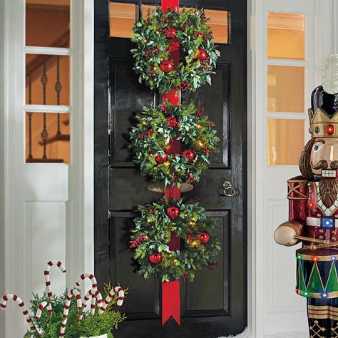 Cordless Triple Wreath Door Hang - The Green Head Christmas 3 Wreaths For Front Door, Triple Wreaths On Front Door, Three Wreaths On Front Door, Triple Wreath Christmas Door, Christmas Wreath Trio, Green And Red Wreath Front Doors, Christmas Wreaths Plug In Outsoor, Red Christmas Wreath Nutcracker, Over-sized Outdoor Christmas Wreath Balcony