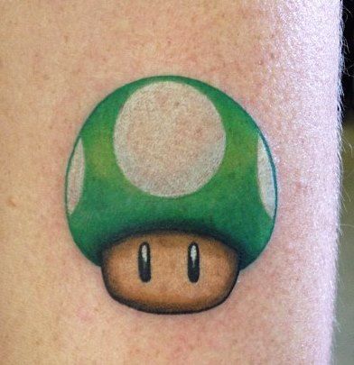 Mario Mushroom: Custom tattoo by Jason Dasaro at Arrows and Embers in Concord, NH #Jason #NH #newengland #mario #mushroom #color #tattoo #inkedup #best #love #picoftheday #proartist #ink #art #bodymodification 1up Tattoo, Super Mario Tattoo, Black Flowers Tattoo, Mario Tattoo, Pokemon Tattoos, Mushroom Color, Old Pokemon, Prison Tattoos, Mushroom Tattoos