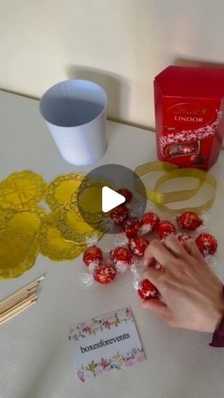 Rubbia on Instagram: "Chocolate Wedding Favours   #chocolate #fyp #wedding #birthday #party #shadi #favours #treats #giveaways #instalike #instareels #byrubbia #lindt #lindor #paperdoilies #chocolates #chocolatetreats #weddingseason #ideas #gifts #howto #asmr #foryou" Lindt Chocolate Gift Ideas Diy, Lindt Gift Ideas, Lindt Chocolate Wreaths, Lindt Chocolate Ball Wreath, Lindt Chocolate Gift Ideas Christmas, Rolo Christmas Treats, Lindor Chocolate Gift Ideas, Lindt Bouquet, Lindt Chocolate Gift Ideas