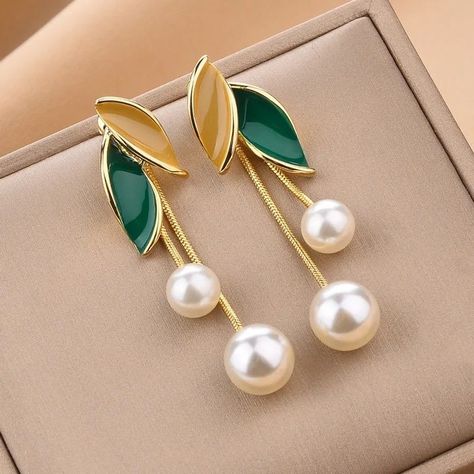 Looking for fashion leaf alloy splicing artificial pearls dangling earrings that offer quality, style, and affordability? Well you are at the right place! 🛍️ Our wide range of products are designed to provide exceptional benefits, so you can enjoy the best customer experience possible. Plus, we're currently offering exclusive deals on our inventory. 🎉 Shop now and see why customers love us! #onlinestore #shopping #qualityproducts #affordability #customersatisfaction Artificial Earings Design Modern, Artificial Jewelry, Gold Earrings Models, Love Us, Dangling Earrings, Customer Experience, Gold Earrings, Dangle Earrings, Shop Now