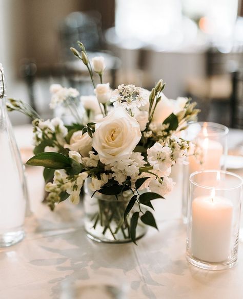 Sweet and petite wedding centerpiece

Vase centerpiece with white roses, white lisianthus, white larkspur, ruscus greens, votive candles
⁠ White Centerpiece Wedding Simple, Elegant Simple Centerpieces Wedding, Simple Rose Centerpiece Wedding, Small White Flower Arrangements, White Floral Centerpieces Wedding, White And Green Wedding Centerpieces, White Centerpiece Wedding, Short Wedding Centerpieces, Wedding Florals White