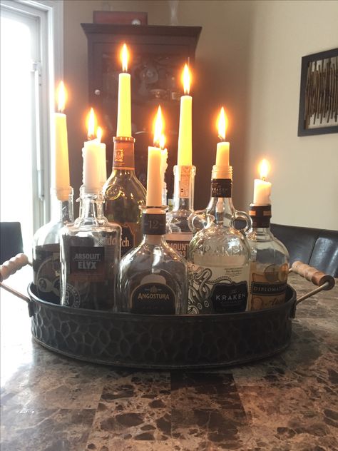 Perfect way to repurpose old liquor bottles for under 10$. Vintage and classy look as a centrepiece, patio, or man cave. Classy Halloween Party, Old Liquor Bottles, Liquor Bottle Crafts, Classy Halloween, Spooky Halloween Party, Man Cave Home Bar, Bottle Candles, Alcohol Bottles, Old Bottles