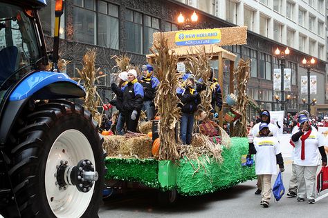 Case New Holland is our sponsor of the inflatables program of the McDonald's Thanksgiving Parade.  Pictured here is the New Holland Agriculture's "Fall Harvest Float."  Over 100 volunteers from Case New Holland participated in the parade, from riding on this float, handling our giant balloons, working in our green rooms, and much more.  This Chicagoland company truly embraces the parade and is a valued partner of the McDonald's Thanksgiving Parade. Thanksgiving Float Ideas, Fall Float, Parade Float Decorations, Homecoming Floats, New Holland Agriculture, Floating Decorations, Thanksgiving Parade, Thanksgiving Day Parade, Fall Fest