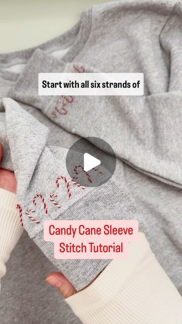 Laine Irene on Instagram: "Mini Candy Cane Sleeve Tutorial ❤️

The perfect, festive touch to add to the sleeves of the sweatshirt you’ll be wearing while you decorate your tree and hang your stockings this year! 

Comment CANDY CANE for a link to a full length YouTube tutorial, these stitching stickers, and the sweatshirt I used in this video! 
.
.
.
#candycanes #christmascrafts #festivefashion #dmcembroidery #merryandbright" Candy Cane Applique Pattern, Candy Cane Embroidery Stitch, Diy Candy Cane Outfit, Diy Christmas Sweatshirts, Sleeve Tutorial, Diy Christmas Sweater, Mini Candy Canes, Holiday Clothes, Fabric Christmas Trees