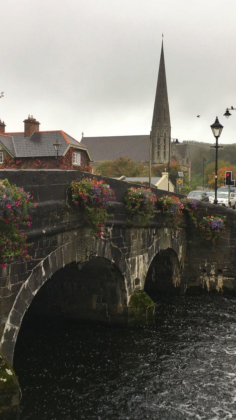 A lovely historical bridge over Carrowbeg River. This is Westport in County Mayo, Ireland on the Wild Atlantic Way. Voted as the best place to live in Ireland, #Westport is an adorable small town in Co Mayo. There are pretty streets, flowers, delicious food and a lovely historical mansion - Westport House. #travel #wildatlanticway Rainy Ireland Aesthetic, Living In Ireland Aesthetic, Living In Ireland, Ireland Travel Aesthetic, Ireland Living, Historical Mansion, Western Ireland, Irish Aesthetic, Westport Ireland