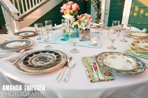 mix matched china. I really want to do this, but not sure if it will just be a waste because we won't want to preset the tables for a buffet? I think it's gorgeous though and will be really fun to build the collection over the year (thrift stores, yard sales, estate sales, etc) Vintage Wedding Table Settings, Mismatched Plates, Vintage Wedding Table, Vintage Thrift Stores, Mismatched China, Wedding China, Tafel Decor, Eclectic Wedding, Shabby Chic Wedding