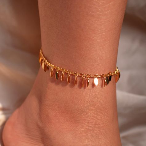 Step into the party with glamour and grace wearing our Gold Chacha Anklet - adorned with delicate leaves for a touch of natural elegance. This ankle bracelet isn't just a gift; it's a dazzling expression of style and sophistication, making it the perfect accessory to elevate her look with a gorgeous sparkle! #YOU MAY LIKE THIS Birthstone anklet https://www.etsy.com/listing/1545880373/birthstone-anklet-shiny-layered-chain dainty gold anklet https://www.etsy.com/listing/1699658668/dainty-gold-ankl Ankle Bracelets Gold, Bracelets Wedding, Wedding Anklets, Anklet Designs, Layered Chain, Luxe Jewelry, Gold Anklet, Layered Chains, Minimalist Bracelet