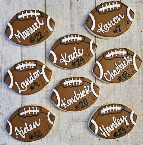 Football cookies are festive treats shaped like footballs e jerseys. These cookies are popular at tailgates, birthday parties, and Super Bowl gatherings. They can be customized with different colors to celebrate favorite teams or special events. These delightful snacks not only satisfy a sweet tooth but also add a fun thematic touch to any football-themed occasion.  Shipped individually bagged. Completely customizable  - Football (with or w/o name) - Jersey (with or w/o name or number) - Footbal Tailgate Football Party, Football Decorated Sugar Cookies, Football Field Cookies, Fourth Down Football Birthday, Homecoming Cookies Decorated, Football Cookies Royal Icing, Sports Cookies Decorated, Cheer Sugar Cookies, Football Jersey Cookies