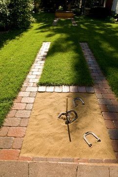 A backyard horseshoe pit designed with pavers blends seamlessly into this home's landscape. Shed Makeover, Living Pool, Brick Walkway, Yard Games, Backyard Games, Traditional Landscape, Backyard Retreat, Backyard Living, Kew Gardens