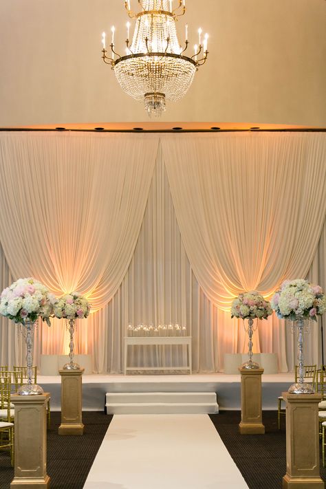 Background draping and small table at altar for floral arrangement Ceremony Decorations Indoor, Wedding Ceremony Decorations Indoor, Diy Wedding Arch, Wedding Setup, Hotel Ballroom, Wedding Venues Indoor, Wedding Ceremony Backdrop, Indoor Ceremony, Wedding Activities