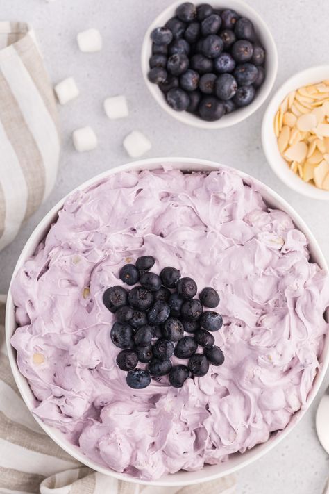 Light and fluffy Blueberry Fluff Salad is a classic dessert salad that’s perfect for your next cookout or for any occasion! Loaded with blueberries, mini marshmallows and studded with sweet pineapple chunks, this easy no bake dessert only takes 5 minutes to whip up. Blueberry Fluff Salad, Blueberry Fluff, Berry Salad Recipe, Dessert Salad Recipes, Grape Salad Recipe, Snickers Salad, Blueberry Desserts Recipes, Fluff Salad, Blueberry Salad