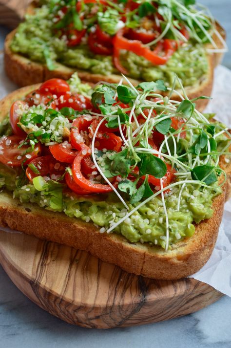 Avocado toast infused with spicy garlicky oil, flavored with cilantro, scallions, garlic, lime juice & topped with cherry tomatoes, hemp seeds, microgreen. Avocado Toast Recipe, Recipe Vegetarian, 140 Pounds, Think Food, Avocado Recipes, Toast Recipes, Healthy Nutrition, Nutrition Recipes, Cherry Tomatoes