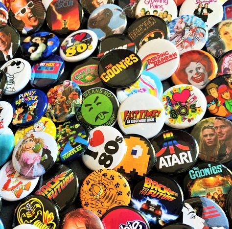 You will receive a set of (six) 80s Mystery Pinback Buttons. See any you have your eye on? Just add them to notes below. Want to make a custom set of your own? Just send us a message of your buttons and we will design and send your own listing! ⭐️ ⭐️Buttons are 1.25 inches in size or size of a quarter. Stop by our shop https://www.etsy.com/shop/MagicUniqueTreasures for more magical treasures! 80s Pins And Patches, Etsy Shop Aesthetic, Things I Want To Buy List, Pin Ideas Button, Button Pins Aesthetic, Mystery Scoop, 80s Things, 80s Shows, Style Année 80