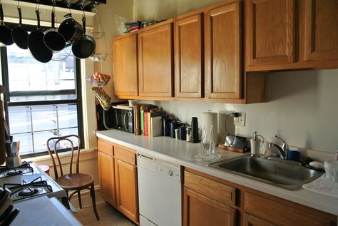 A cozy and fully-stocked galley kitchen Apartment Galley Kitchen Ideas, Small Apartment Galley Kitchen, Apartment Galley Kitchen, Narrow Apartment, Galley Kitchen Ideas Narrow, The Galley Kitchen, Tiled Fireplace, Easy House Cleaning, Small Galley Kitchen