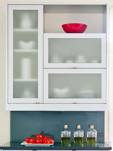 Upper cabinet doors equipped with glass panels handily balance lower cabinets' solid forms, but can be a little too transparent for some tastes. These textured glass panes handily blur cabinet contents, while introducing a subtle undulating pattern to the streamlined kitchen. / Aluminum Kitchen Cabinets, Small Galley Kitchen, Glass Kitchen Cabinets, Cottage Kitchen Design, Upper Cabinet, Upper Kitchen Cabinets, Aluminium Kitchen, Cabinet Detailing, Refacing Kitchen Cabinets