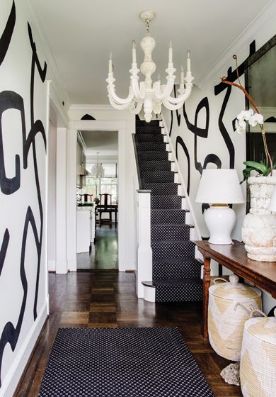 An elegant and bold foyer makes a statement in a classic #Georgetown row home designed by Colman Riddell of @colmanriddellinteriors

Built in 1916, the home is a reflection of the family’s travels around the world mixing textures and materials.

Interior Design: Colman Riddell | @colmanriddellinteriors
Text & Styling: Charlotte Safavi | @stylishproductions 📷: @radifera

#colmanriddellinteriors #design #interiors #interiordesign #dmvdesign #dmvdesigner #chic #antique #boldinteriors #classic Bold Foyer, Black And White Living Room Decor, Row Home, Frame Wallpaper, Staircase Runner, Nook Table, Built In Banquette, Black And White Living Room, Wall Art Diy Paint