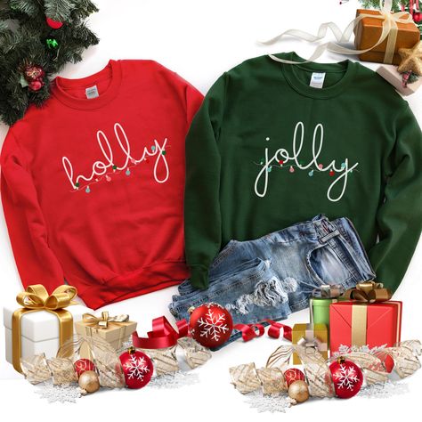 Welcome the most wonderful time of the year, Christmas, in these very cute matching couple Christmas crewneck sweatshirt.  Celebrate the holidays with family and friends and have a very merry Christmas in these sweaters. Holly Jolly Sweatshirt Christmas Couple Sweatshirts Christmas Couple Sweaters Couples Christmas Shirts Christmas Couple Shirts Holly Jolly Shirt His And Hers Gifts This sweater is made from polyester and cotton. This combination helps designs come out looking fresh and beautiful.  The collar is ribbed knit, so it retains its shape even after washing.   Knit in one piece using tubular knit, it reduces fabric waste and makes the garment more attractive.  There are no itchy side seams on these sweaters.  .: 50% Cotton 50% Polyester .: Medium-heavy fabric 8.0 oz. .: Loose fit Couple Sweaters Matching, Matching Couple Sweatshirts, Christmas Couple Shirts, Couples Christmas Shirts, Couple Sweaters, Couples Matching Sweaters, Couples Christmas Sweaters, Matching Christmas Sweaters, Couple Sweatshirts