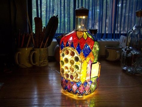 Again, I must say, you all inspire me! From the Hometalker who used permanent colored pens to paint her Royal Crown bottle to other Hometalkers who used various mediums to paint their glass panes or bottles, I wanted to do the same thing....then go a step further. Drilling through glass was something I figured was beyond my expertise, but I watched many a youtube, and gleaned bits and pieces of common sense for this craft. Here's what I did, and it's super simple. Come on, I'll show… Stained Glass Bottles, Glass Crafts Diy, Wine Bottle Crafts Christmas, Crown Bottle, Basket Makeover, Bottles Diy, Decorated Bottles, Wine Bottle Lamp, Old Mirrors