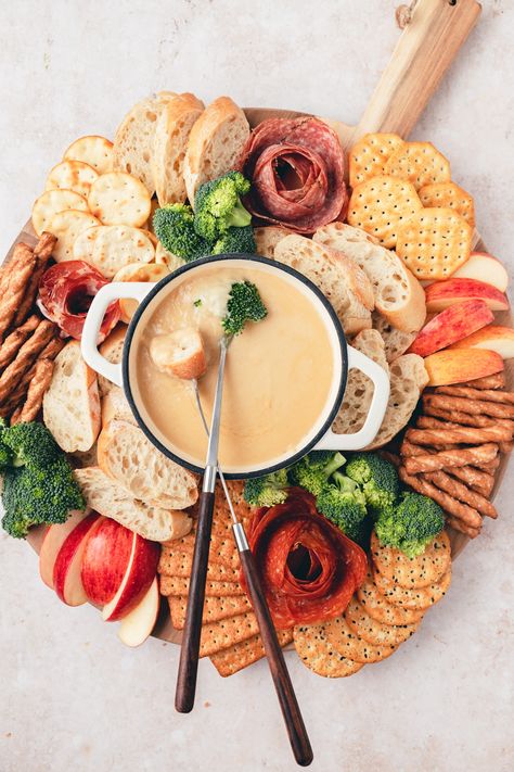 This beer cheese fondue board is one of my favorite fall appetizers! It's super easy to make and sure to be the star of any party spread! 2024 Cheese Board, Fondu Board, Charcuterie Fondue Board, Charcuterie Board Fondue, Couple Charcuterie Board, Beer Cheese Board, Fall Fondue Party, Cheese Fondue Charcuterie Board, Best Cheese Fondue Recipe