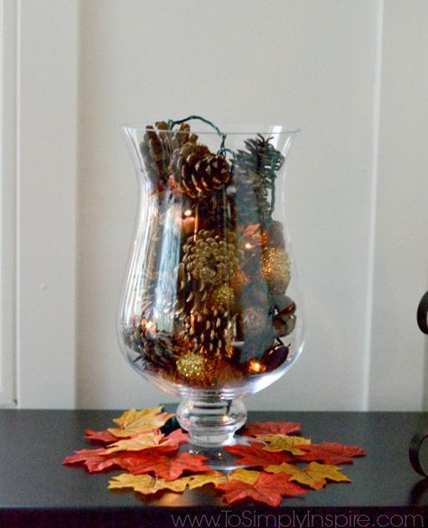 Make this simple DIY Pine Cone Vase Filler with Fairy Lights in just a few minutes to add a little glowing Fall decor to your table. Glass Vase Filler Ideas, Vases Photography, Fall Vase Filler, Vases Shapes, Vases Antiques, Vases Drawing, Vases Arrangements, Vase Filler Ideas, Pink Vases