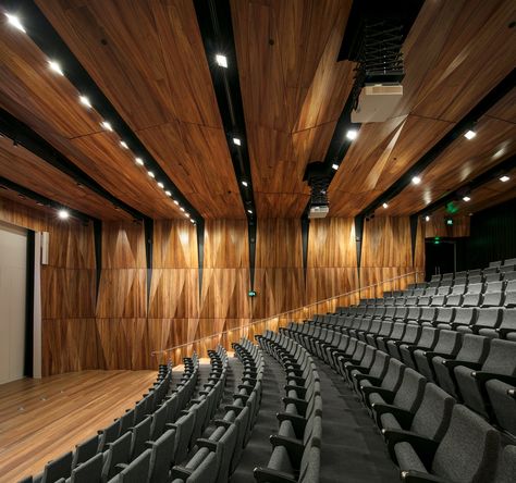 A state of the art precinct at the University of Melbourne incorporates a 300 seat auditorium, 5 drama rooms, art gallery, music room and classrooms over 3 levels. Atkar is incredibility proud to work on such an unforgettable project. #atkar #acoustic #perforations #customised #interiordesign #architecture #perforated #acousticpanels #newbuild #ceiling #walls #acousticdesign #architecturaldetail #commercialdesign #interior #architectural Timber Auditorium, Auditorium Design Interiors, Auditorium Ceiling, Auditorium Interior, Lecture Hall Design, Classroom Architecture, Hall Room Design, Acoustic Room, Auditorium Design