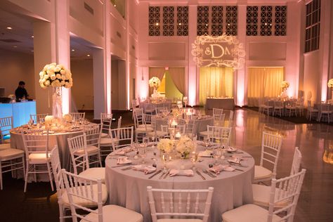 Wedding Reception all White Decor with Chiavari Chairs, Tall Floral Centerpieces and Projection Bride and Groom Initials GOBO and Pink Uplighting | Tampa Wedding Lighting Nature Coast Entertainment Services | Tampa Wedding Venue The Vault | Tampa Wedding Planner Special Moments Uplighting For Wedding Reception, The Vault Tampa Wedding, White Uplighting Wedding, Pink Uplighting Wedding, Tall Floral Centerpieces, Pink Uplighting, All White Decor, Wedding Uplighting, Vintage Wedding Venues