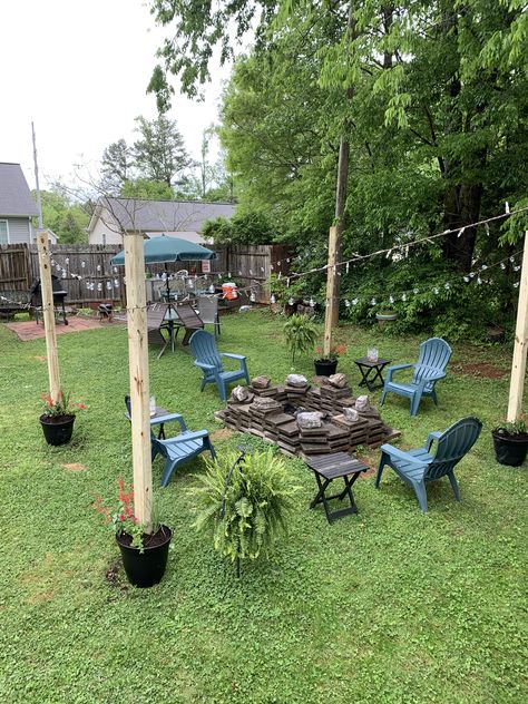 Flower Pot With Pole For Lights, Landscaping Around Telephone Pole, Concrete Posts In Buckets, Yard Post Ideas, Utility Pole Landscaping, Post In Flower Pot, Backyard House Design, Small Backyard House, Flower Pot Lights