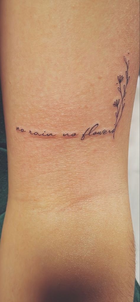 Quote Tattoos For Women With Flowers, Small Quote With Flower Tattoo, Tattoos About Acceptance, Rain Quotes Tattoo, Writing Into Flower Tattoo, Writing Tattoos With Flowers, Fine Line Tattoos On Arm, No Rain No Flowers Cursive Tattoo, With Rain Comes Flowers Tattoo