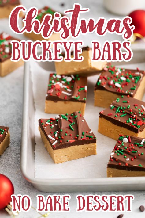 If you’re looking for a buckeye recipe that doesn’t require hours of rolling and dipping, you’ve come to the right place! These bars have a sweet, crumbly peanut butter layer and are topped with rich chocolate– but the best part is they only take a few minutes of prep work! Buckeye Bars Recipe | No Bake Dessert Recipe | Christmas Desserts | No Bake Christmas Desserts #christmas #dessert #chocolate Mini Brownie Christmas Treats, No Bake Buckeye Bars Recipe, Peanut Butter Christmas Desserts, Christmas Chocolate Chip Cookie Bars, Holiday Dessert Bars Christmas, Buckeyes Bars Recipe, Christmas Peanut Butter Fudge, No Bake Desserts For Christmas, Graham Cracker Christmas Bark