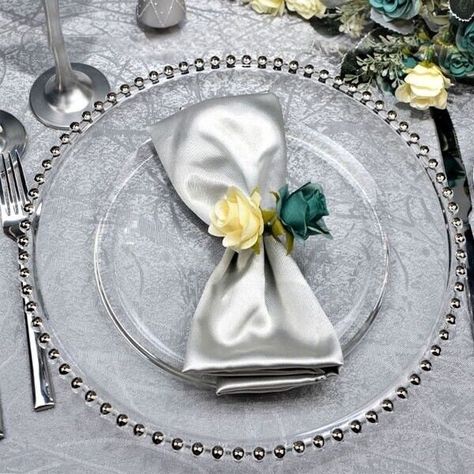 Pearl Bead Design Charger Plates x12 Silver charger plates for sophisticated styling Clear glass adorned with silver pearl shaped beading around the edge simple, elegant and timeless  These service plates are robust and easy to clean Rich colour and texture adding a classic touch to any event  These under plates protect the table surface when serving hot food Great for enhancing the decoration of a dining table for special occasions and events such as weddings, dinner parties, Christmas parties, dinner dates etc. Can also be used as a display for decorating centrepiece Perfect way to add elegance to any dinning table for a fine dining experience Specification:  13''/33cm diameter Note: *Handwash Recommended  *Some plates may have blemishes/air small scratches on side of plate pockets as th Silver Charger Plates, Silver Chargers, Gold Charger Plate, Glass Charger Plates, Gold Chargers, Glass Wedding, Venue Decorations, Hot Food, Charger Plate