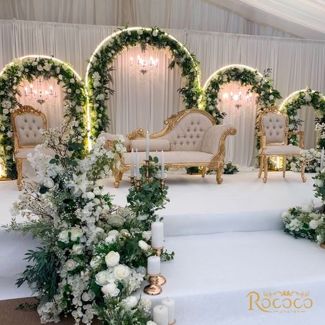 Absolutely loved creating this stunning wedding decor! 🤍 Swipe to see one of our favorite setups yet. #WeddingDecor #EventStyling Decor: @rococo.events Venue: @keythorpemanor #weddingdecorators #weddingdecorinspiration #eventdecorators #floraldecoration #weddinginsporation #ukweddingplanners #floralwedding white, green, gold, wedding theme, staging, archway, floral arch, table decor Green Gold White Wedding, White Green Gold Wedding, Engagement Table Decorations, Muslim Wedding Decorations, Reception Background, Engagement Table, Nikkah Decor, Green Gold Weddings, Arch Table