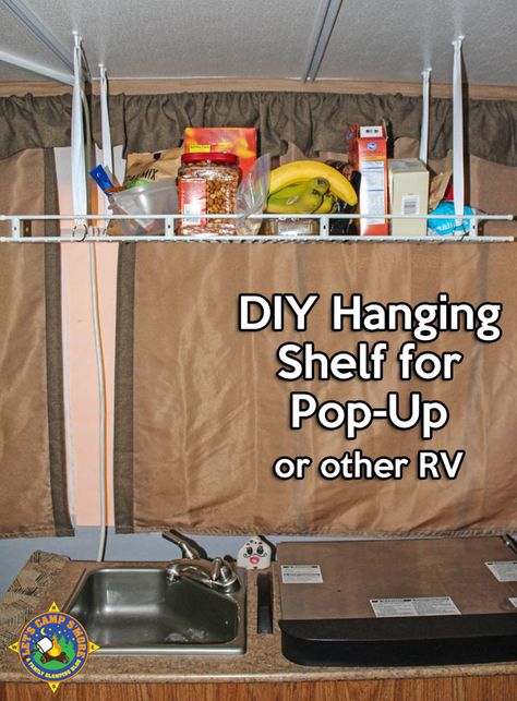 Simple DIY Hanging Shelf Hack for a Pop-Up Camper - Make this simple hanging shelf with an old wire shelf and a few other inexpensive items. It helps you keep the trailer organized. #popup #mod #RV Diy Hanging Shelf, Jayco Pop Up Campers, Tent Trailer Camping, Tent Trailer Remodel, Popup Camper Remodel, Pop Up Tent Trailer, Pop Up Trailer, Camping Diy, Camper Organization