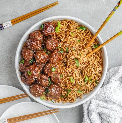 A fabulous weeknight meal is always good to have in your back pocket. The meal that takes a few minutes to prepare, but tastes like you have been slaving all day in the kitchen. This is it my friends.Easy teriyaki meatballs with ramen noodles. The sauce on the ramen takes a minute- no joke, and the teriyaki sauce is from a bottle- sometimes making things from scratch is not worth it. I am totally obsessed with ramen noodles, which pair perfectly with these meatballs. I also happened to… Meatballs And Ramen Noodles, Easy Teriyaki Meatballs, Teriyaki Pineapple Meatballs, Sesame Ramen, Pineapple Meatballs, Teriyaki Chicken Meatballs, Easy Breakfast Burritos, Teriyaki Noodles, Asian Dinner