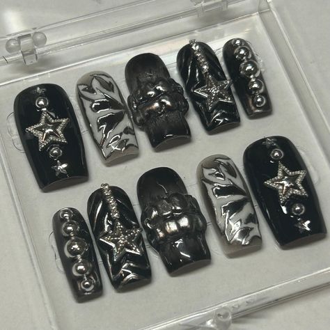 This ATE inspired set screams "STRAY KIDS" With their new album dropping soon, the digital cover was the ultimate inspiration for these nails. Adorned with metallic stars, silver pearls, and 3D grills, this set is as extra as they come. These nails are perfect for a concert or for everyday wear if you're a SKZ connoisseur on the daily!  Available in shape Medium Square.  This set includes 10 nails fit to your personal sizes in the exact design pictured. Follow instructions listed in personalization for accurate sizes as refunds for incorrect sizes are not permitted.  Included in this purchase is: - Acrylic Display Case - 10 Nails in desired design - Application kit - Stickers and Thank Yous Stray Kids Inspired Nails Ate, Ate Nails Skz, Gothic Acrylic Nail Designs, Straykids Ate Nails, Stray Kids Nails Inspired, Skz Nails Design, Skz Inspired Nails, Xg Nails, Stray Kids Inspired Nails