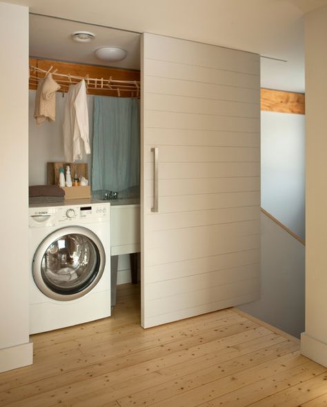 7 Alternative Places to Put Your Washing Machine | Houzz UK Contemporary Laundry Room, Laundry Doors, Passive House Design, Hidden Laundry, Internal Sliding Doors, Basement Laundry Room, Laundry Room Doors, Sliding Door Design, Laundry Room Closet