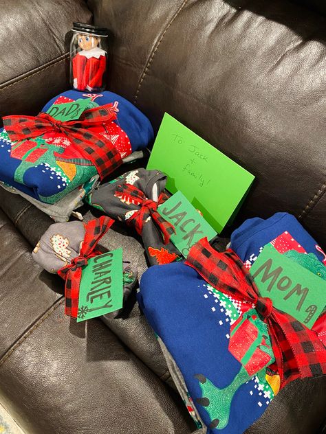 Stinky gave the entire family Christmas pajamas! He left a note asking us to wear them and take him to look at Christmas lights. Pajama Gift, Pajamas Gift, He Left, Family Christmas Pajamas, Shelf Ideas, Christmas Pajamas, On The Shelf, The Elf, Family Christmas