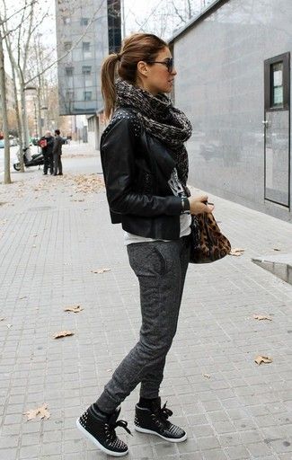 Women's Black Studded Leather Biker Jacket, White and Black Print Crew-neck T-shirt, Charcoal Sweatpants, Black Leather High Top Sneakers Trenchcoat Outfit, How To Wear Sweatpants, How To Wear Joggers, Moda Rock, Black High Top Sneakers, Mode Tips, Walking Down The Street, Sweatpants Style, Winter Stil