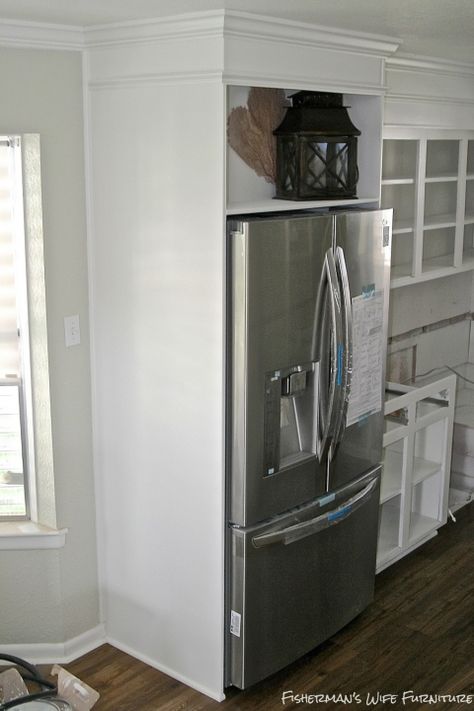 built-in fridge enclosure in a small white kitchen, Fisherman's Wife Furniture featured on Remodelaholic.com Refrigerator Enclosure, Refrigerator Design, White Kitchen Makeover, Faux Brick Backsplash, Small White Kitchens, Faux Brick Panels, Refrigerator Cabinet, Brick Paneling, Built In Refrigerator