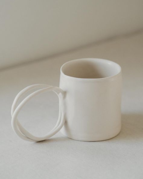 Porcelain Mug with handle from the Air Matte Collection. You can find it on the website online store. Dishwasher safe. #pottery #clay #makers #ceramics #porcelain #handmade #craft #interiordesign #decoration #texture #tableware #tabletop #artisans #foodprops #pottersofinstagram #makersmovement #mindfulliving #ceramicart #freeart #mindful #openminded #zenart #potterylove #clayart #clayartist #handbuildpottery #handmadeceramics #handbuild #ceramicistsofinstagram #theartofslowliving Porcelain Handmade, White Food, Food Props, Pottery Clay, Mug With Handle, Hand Built Pottery, Porcelain Clay, Porcelain Mugs, Lighting Collections