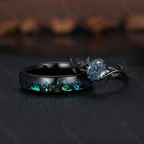 Introducing a mesmerizing two piece couple ring set, featuring a black fire opal engagement ring for Women and a Men's beautifully crafted tungsten wedding bands, perfect for those making it the perfect choice for any proposal. -----Ring Information----- Metal Type: 925 sterling silver, Tungsten ✦ Her Ring 925 solid sterling silver with black rhodium finish (message me if you need other band color or metal) Center stone: Lab created black opal Stone size: 6.5mm round cut (message me if you need Meteorite Wedding Ring Set, Dark Opal Engagement Ring, Black Australian Opal Ring, Black Gemstone Engagement Rings, Black Fire Opal Engagement Ring, Starry Night Ring, Obsidian Wedding Rings, Black Wedding Rings Women, Black Wedding Ring For Women