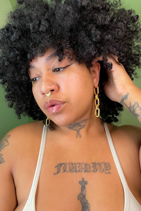 @le.siren (IG) rocks the Illuminate Collection in their green era. Wearing: Warhorse clicker in yellow gold | Septum Tender threadless ends in seafoam tourmaline | Nostrils Illuminate Small in Peridot | Philtrum Chain Reaction Traditional in yellow gold | Lobes All available in 14K yellow, rose, and white gold. See it all in the New Arrivals section of the website. Nostril Chain Piercing, Chest Piercings For Women, Medusa Piercings, Chest Piercing, Medusa Piercing Jewelry, Philtrum Piercing, Medusa Piercing, Creative Fashion Photography, Stretched Lobes