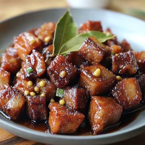 🍖🥢 Crispy Pork Adobo Bites: Savor the classic adobo flavor in bite-sized delights! 🍖🥢 #FilipinoCuisine #AdoboLovers Crispy Pork Adobo Bites Ingredients: Pork belly (500g, cubed) Soy sauce (1/4 cup) Vinegar (1/4 cup) Garlic (5 cloves, minced) Bay leaves (2) Peppercorns (1 tsp) Oil (for frying) Instructions: Marinate pork in soy sauce, vinegar, garlic, bay leaves, and peppercorns for 1 hour. Boil until tender, then fry until crispy. 🥢 Perfect for a snack or appetizer, these adobo bites are ... Pork Adobo, Instagram Recipes, Twisted Recipes, Marinated Pork, Crispy Pork, Trending Recipes, Bay Leaves, Filipino Recipes, Adobo