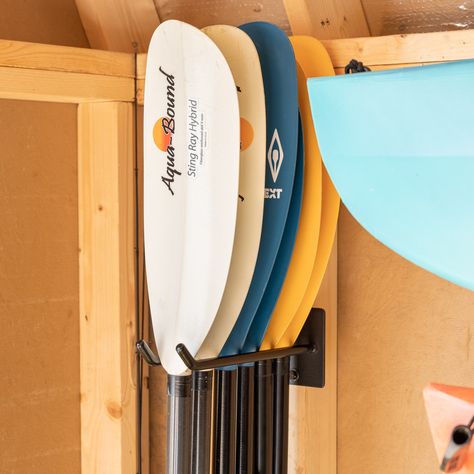 Heavy-duty, organized wall storage for paddles! Protective PVC coating gently holds paddles Holds kayak, SUP, and canoe paddles Maximum storage, holds up to 6 paddles Easy installation, mounting hardware included Supports up to 50 lbs 12" L x 4" W x 4.5" H Life Jacket Storage Ideas, Paddle Storage, Kayak Storage Garage, Paddle Board Storage, Canoe Storage, Cabin Storage, Wall Stud, Canoe Paddles, Garage Storage Inspiration