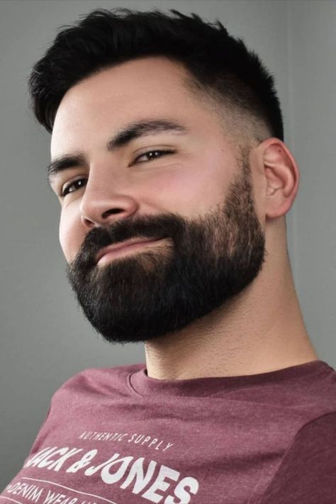 Young man with thick heavy stubble short beard style latest trend Hair Cuts For Round Faces Men, Faded Beard, Round Eyebrows, Short Beard Styles, Short Boxed Beard, Beard Stubble, Thick Mustaches, Faded Beard Styles, Face Trimmer