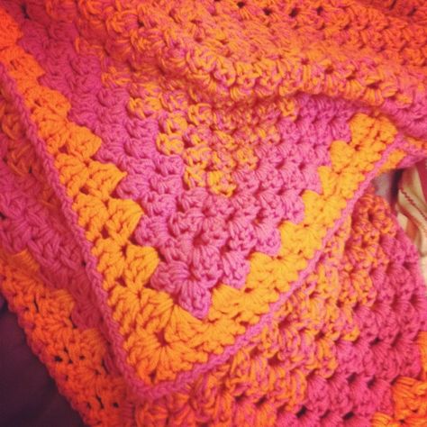 Crocheted pink and orange afghan. My youngest daughter’s favorite colors. Orange Crochet Blanket, Pink Color Combos, Pink And Orange Crochet, Onesie Pattern, Crochet Hat Sizing, Orange Color Combinations, Crochet Mens Hat, Crochet Hat With Brim, Crochet Baby Cocoon